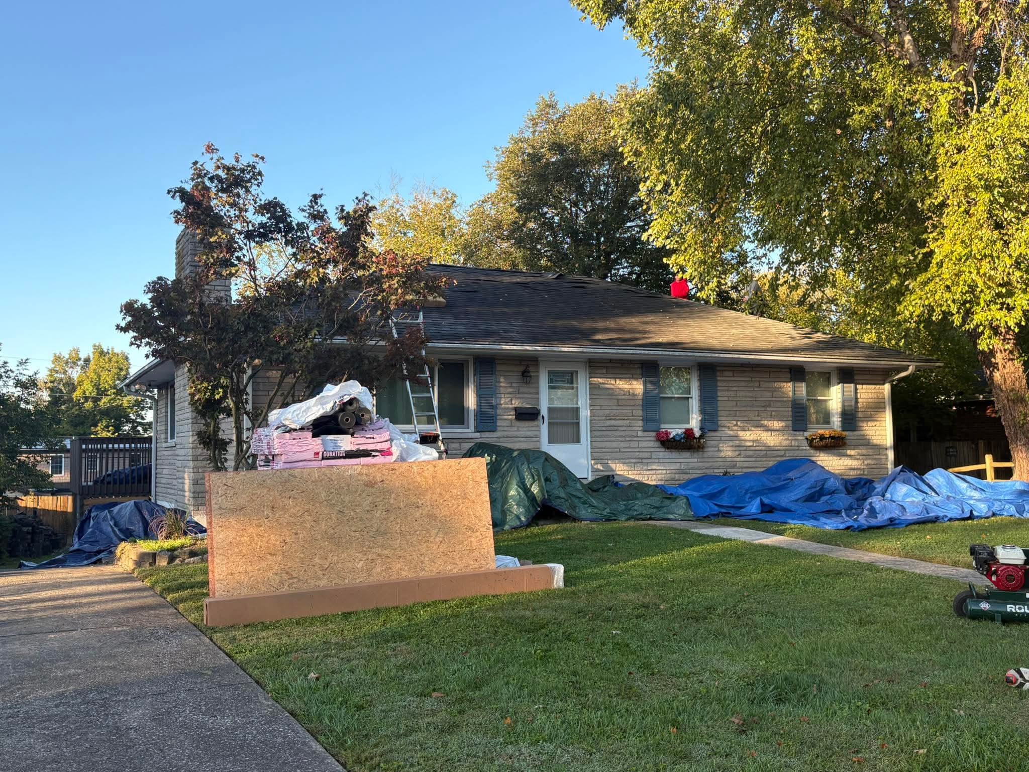 Arcline Roofing crew working on a residential roof replacement